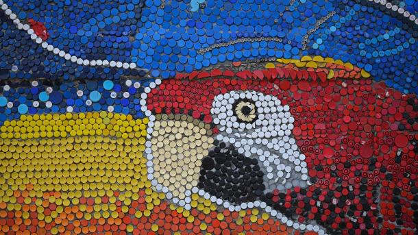 Bottle cap mural by Oscar Olivares in Guatire, Venezuela (© FEDERICO PARRA/AFP via Getty Images)