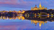 The Parliament buildings across the Ottawa River in Ottawa 