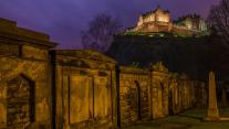 View of Edinburgh Castle from a churchyard in Scotland 