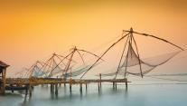 Traditional chinese fishing nets in Kochi, India at sunrise. 