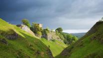 Cave Dale and Peveril Castle in Castleton, Peak District National Park, Derbyshire, England 