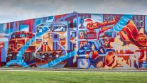 'Power of the Titans' mural by Andrei Krautsou, North Kansas City, Missouri 