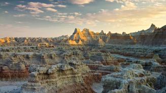 Sunset over Badlands National Park, South Dakota, United States (© Petr Bednarik/Danita Delimont/Alamy Stock Photo)
