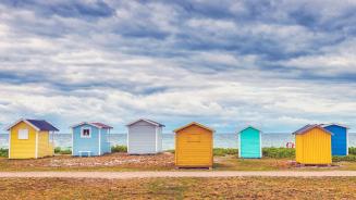 Bathing huts on the beach in Skåne County, Sweden (© Martin Wahlborg/Getty Images)