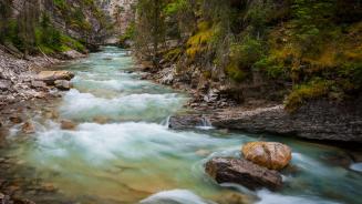 Water flows through Johnston Canyon in Banff National Park (© Jason Hatfield/TANDEM Stills + Motion)