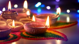 Oil lamps lit during Diwali (© phive2015/Getty Images)