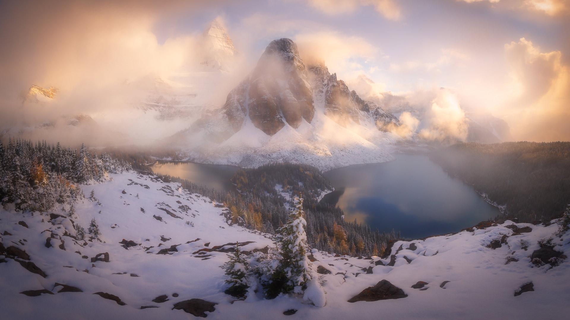 A peak peeks through the clouds