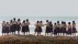 【2018-10-11】 与她们同行 沙滩上的女学生们，印度喀拉拉邦 (© imageBROKER/Alamy)